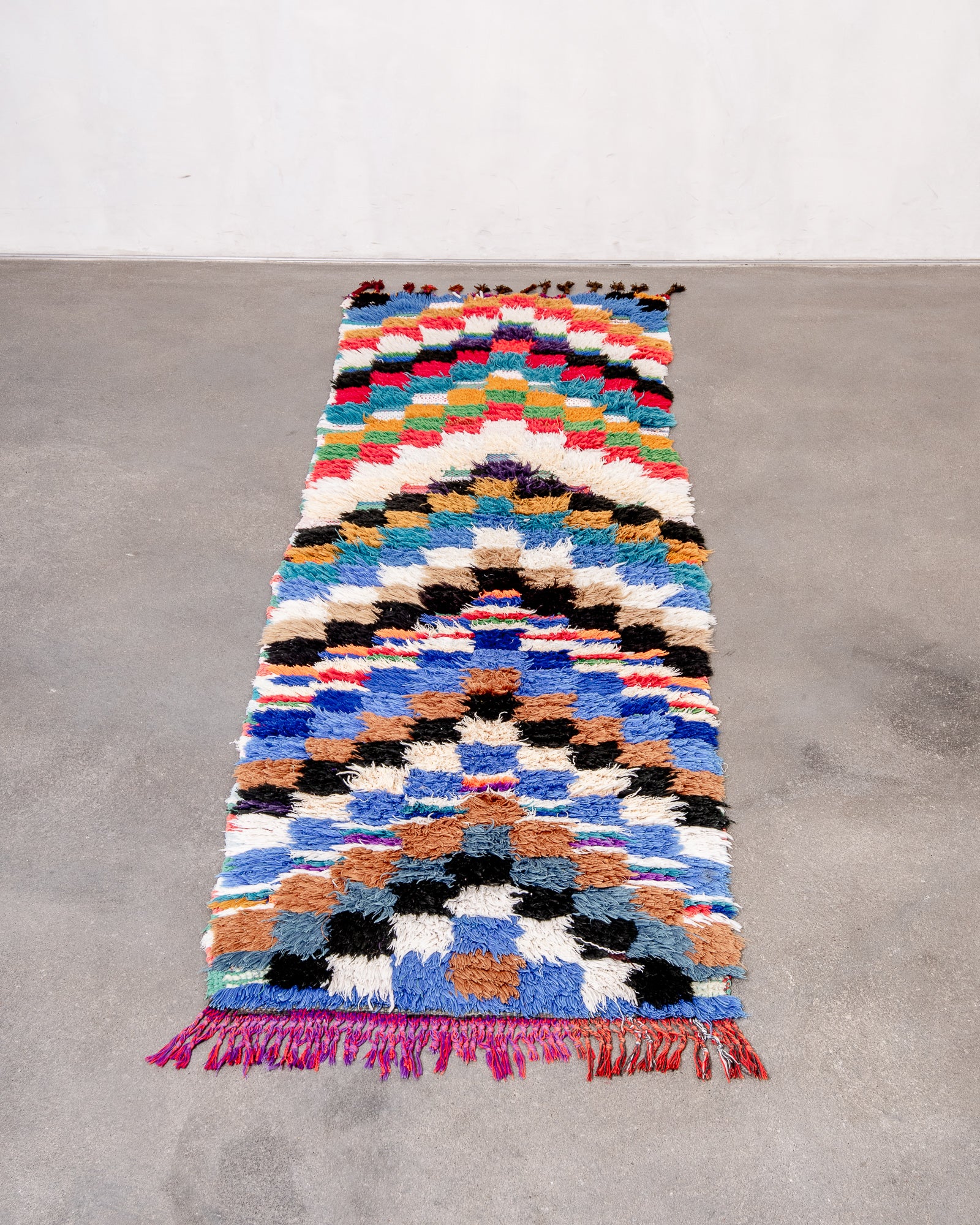 Modern designer handcrafted cotton Berber rug from Morocco. Boucherouite with beautiful colors and patterns.